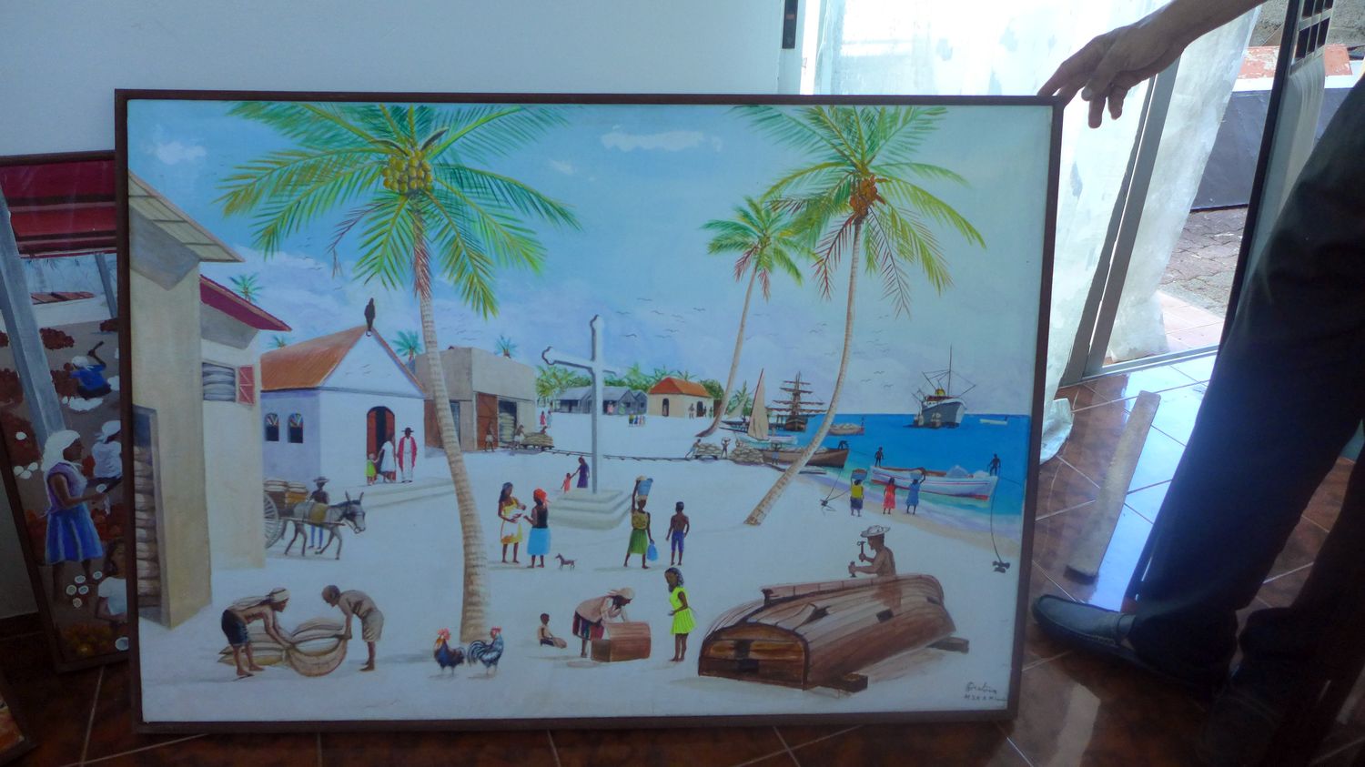 Ici, une peinture représentant une scène du quotidien sur son île natale, Peros Banhos.